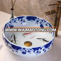 Round fish pattern ceramic art wash basin bathroom blue and white color painted basin cheap sink price